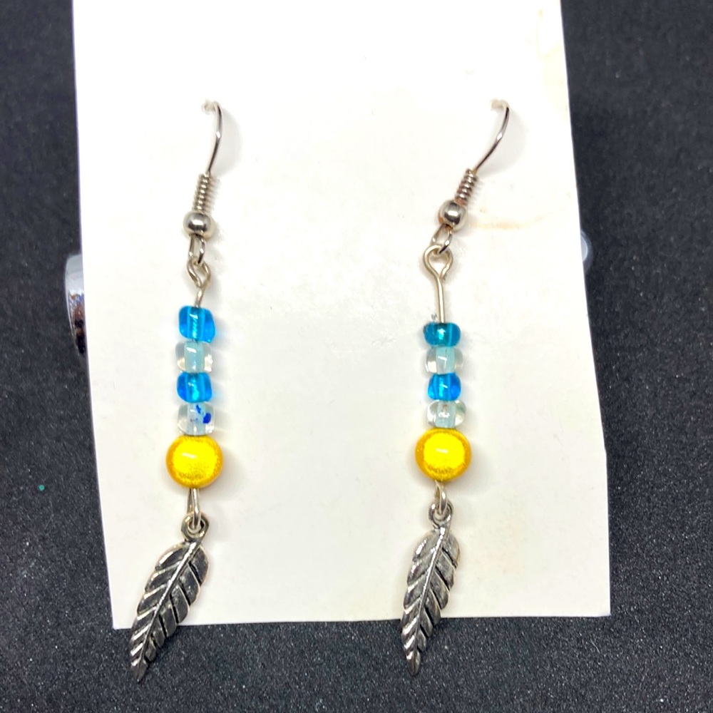 Boho feather charm yellow and blue beaded earrings.